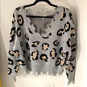 Distressed leopard V-neck sweater